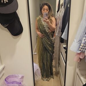 LASHKARAA Elegant Green Saree with Gold Embellishments